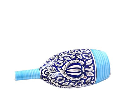 Oval-shaped artisan ceramic vase with Mughal blue patterns.