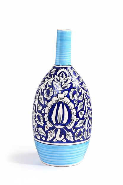 Decorative ceramic bottle with blue and white pattern on a white background