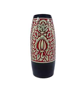 A handmade black and red ceramic vase with a floral Mughal design.
