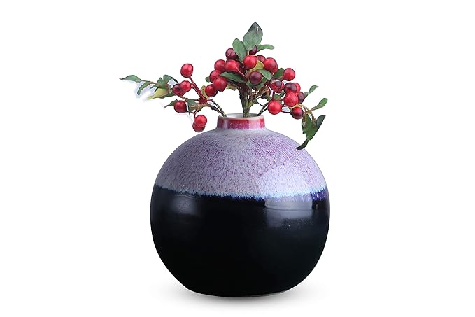 A handmade black ceramic vase with a glossy finish, featuring a matki floral design with red berries.