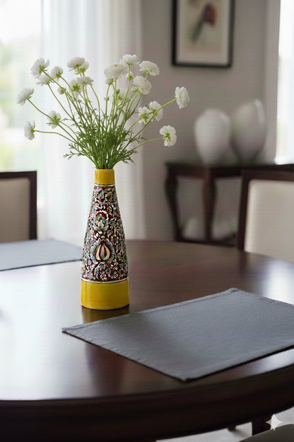 Decorative vase with flowers on a table in a room setting