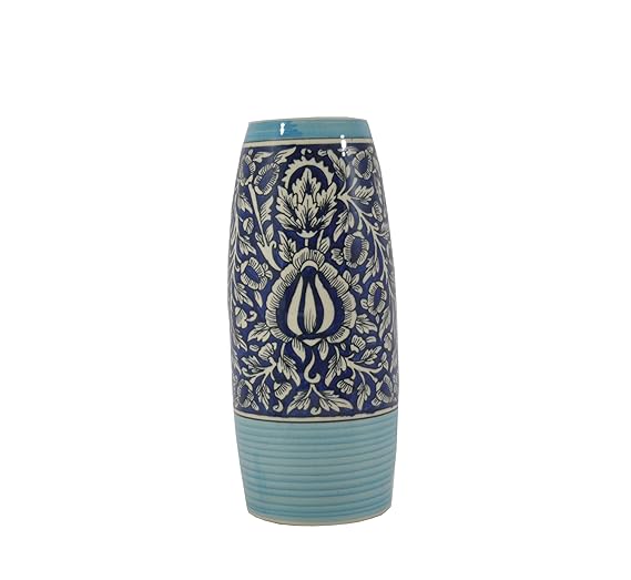 A ceramic handmade vase with a blue glossy finish featuring a floral Mughal design.
