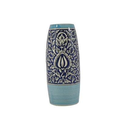 A ceramic handmade vase with a blue glossy finish featuring a floral Mughal design.
