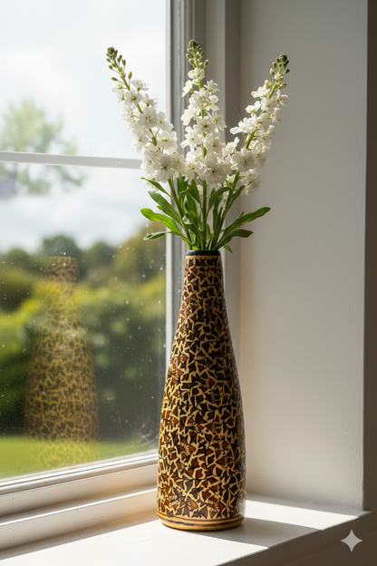 Vase with white flowers on a windowsill