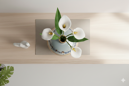 Vase with white flowers on a wooden surface