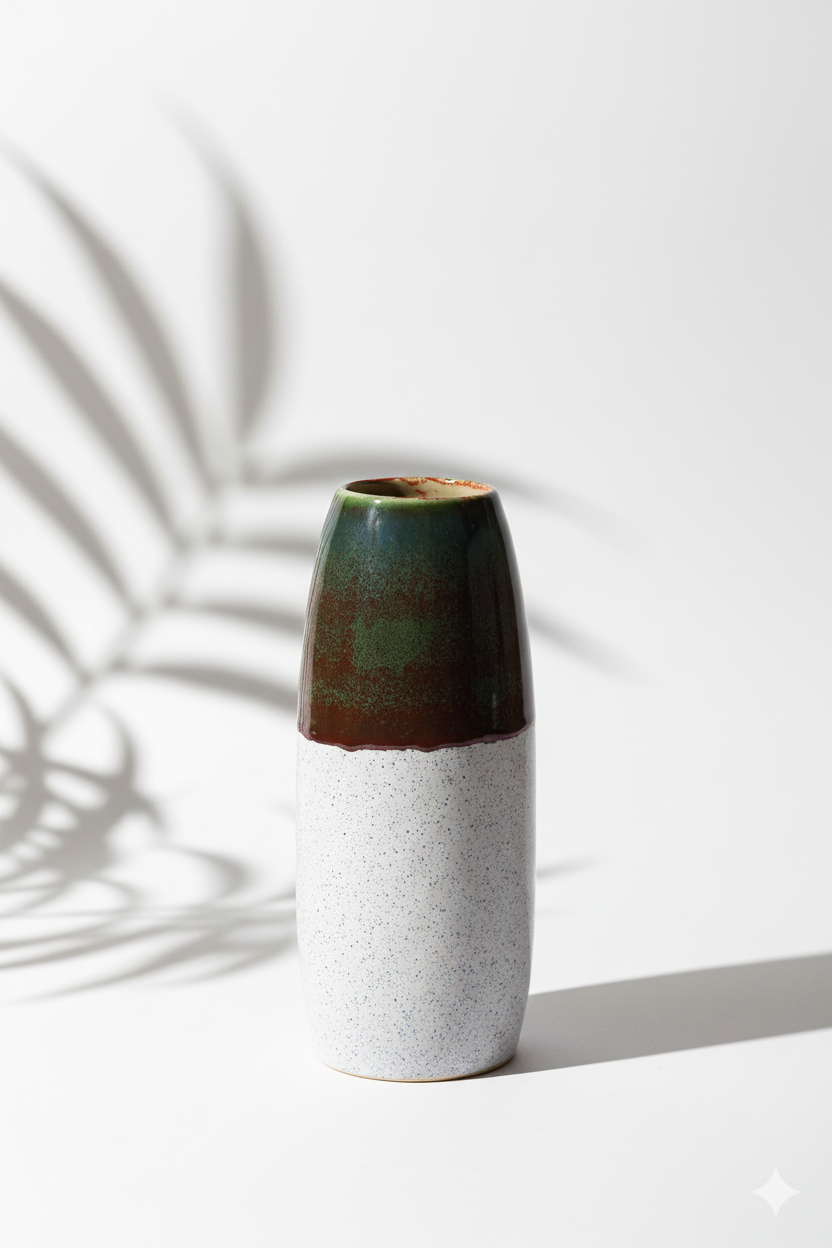 Ceramic vase with two-tone design on a white background